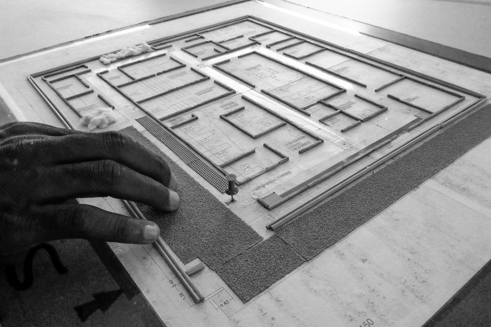 A person reading a tactile floor plan